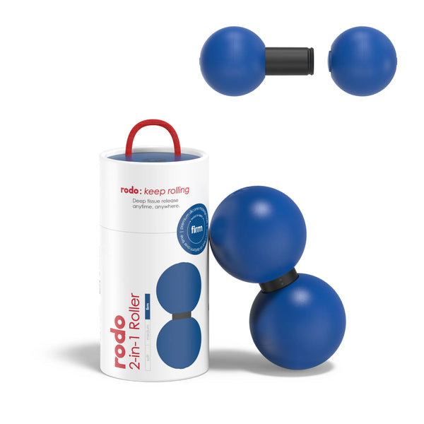 Blue massage roller with black straps and red handle next to its packaging on a white background